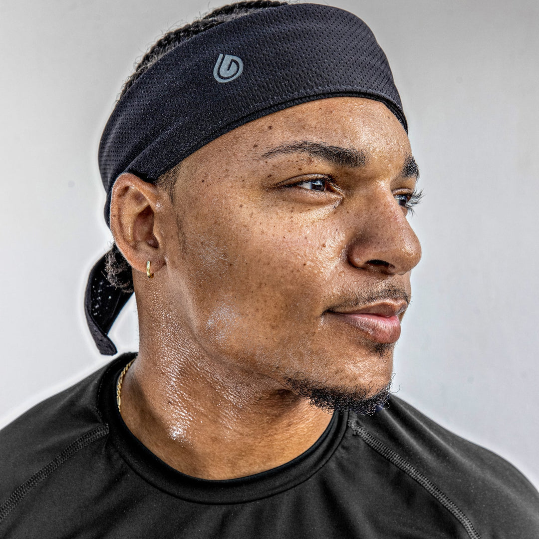 Male wearing Gymwrap Headband for excessive sweating. Read to learn how to reduce sweating on face. Sweat wicking. Cooling. Quick Drying