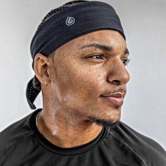 Male wearing Gymwrap Headband for excessive sweating. Read to learn how to reduce sweating on face. Sweat wicking. Cooling. Quick Drying